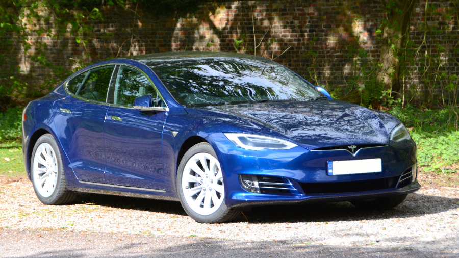 Tesla Model S in blue on driveway